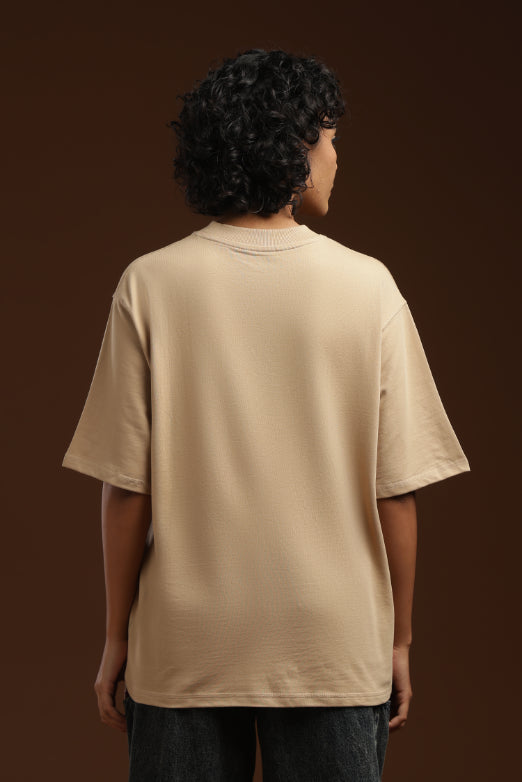 ADEL & VIDA beige oversized t-shirt worn by a model, back view showing soft breathable fabric and minimalist style