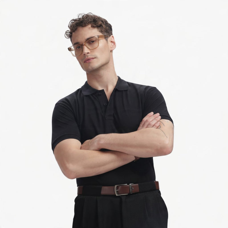 ADEL & VIDA black regular fit polo shirt worn by a model with glasses, featuring a soft and breathable fabric.