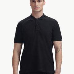 ADEL & VIDA black regular fit polo t-shirt worn by a male model, featuring a soft, breathable, and stretchable fabric.