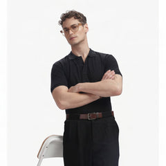 ADEL & VIDA Onyx black regular fit polo shirt worn by a male model with glasses, featuring a soft, breathable fabric.