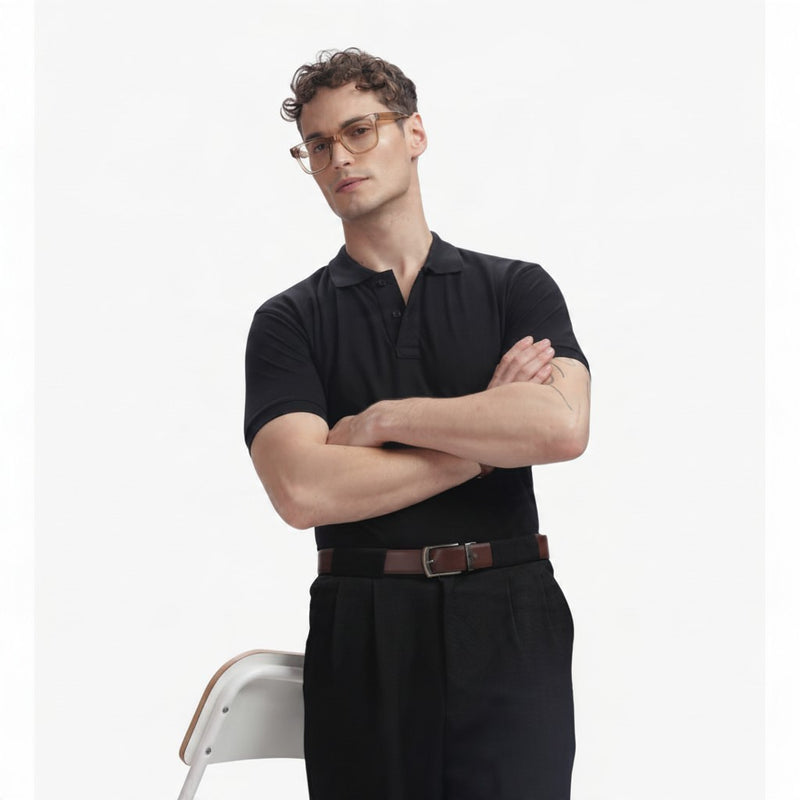 ADEL & VIDA Onyx black regular fit polo shirt worn by a male model with glasses, featuring a soft, breathable fabric.