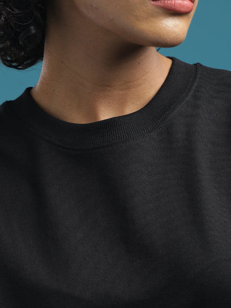 ADEL & VIDA Raven Form oversized black t-shirt with a soft, breathable crew neck design on a model