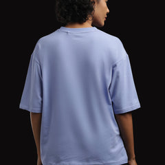ADEL & VIDA Azure Horizon oversized sky blue t-shirt worn by a woman, back view showing soft breathable fabric.
