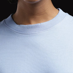 ADEL & VIDA Azure Horizon sky blue oversized t-shirt with a soft ribbed crew neckline on a model