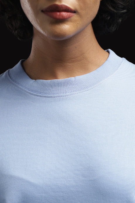 ADEL & VIDA Azure Horizon sky blue oversized t-shirt with a soft ribbed crew neckline on a model