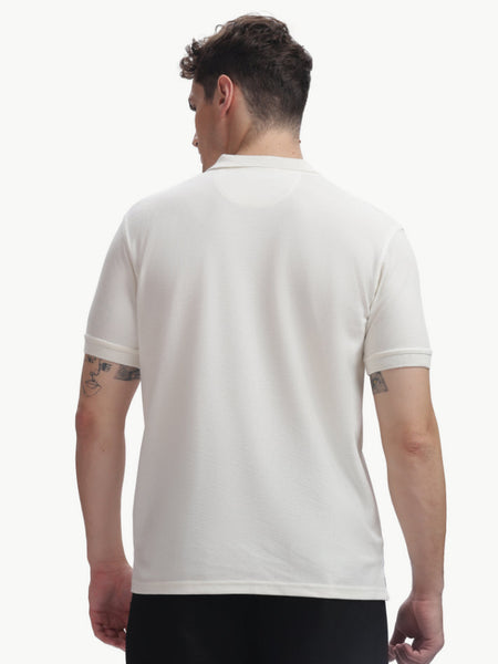 Back view of a man wearing an ADEL & VIDA white regular fit polo t-shirt with a soft, breathable texture.