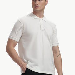 ADEL & VIDA white Pureline polo t-shirt on a male model, featuring a soft, breathable, and stretchable fabric.