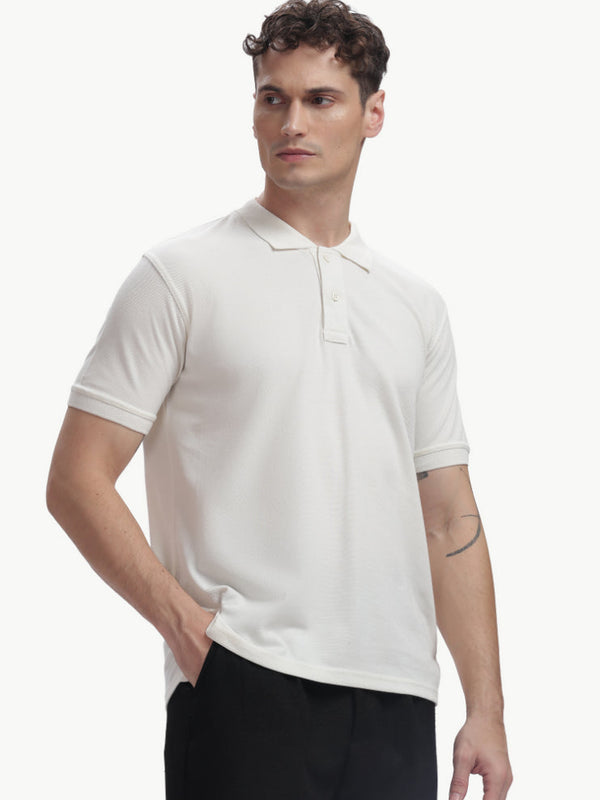 ADEL & VIDA white Pureline polo t-shirt on a male model, featuring a soft, breathable, and stretchable fabric.