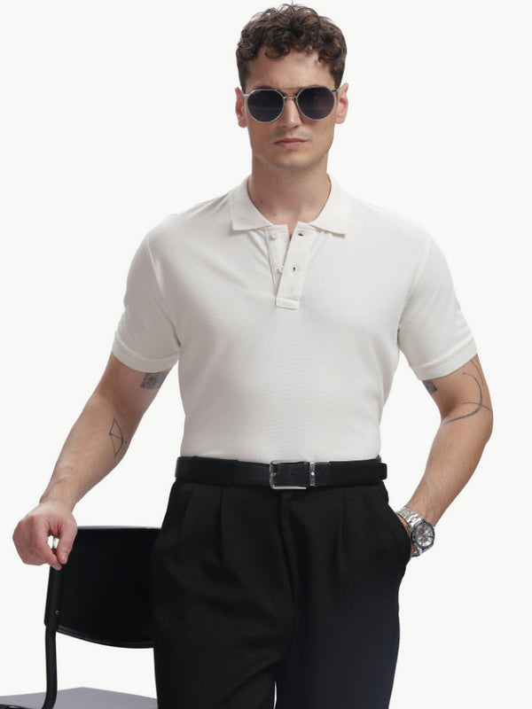 ADEL & VIDA white Pureline polo shirt worn by a male model with sunglasses and black trousers