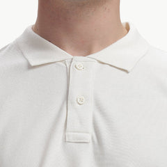 ADEL & VIDA white Pureline polo t-shirt with a classic collar and button placket, made from soft breathable fabric.